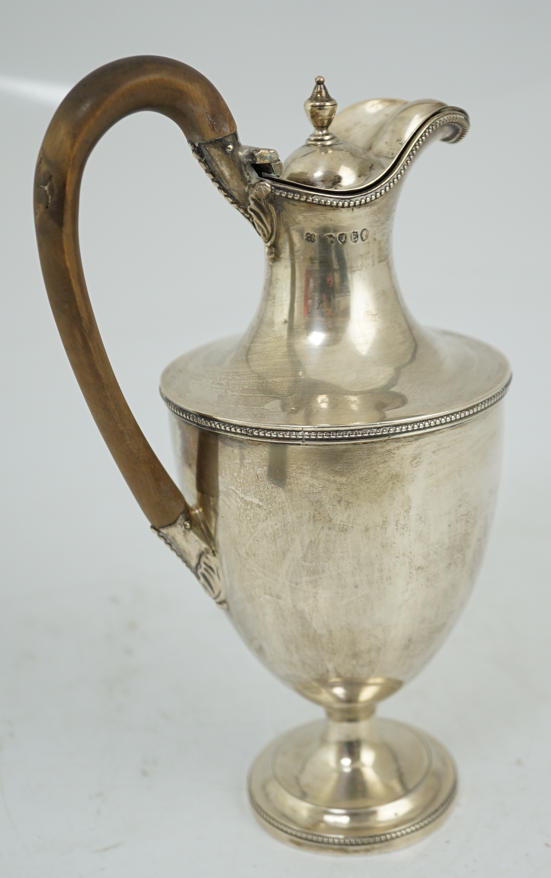 A late Victorian silver pedestal hot water jug, by Jackson & Chase